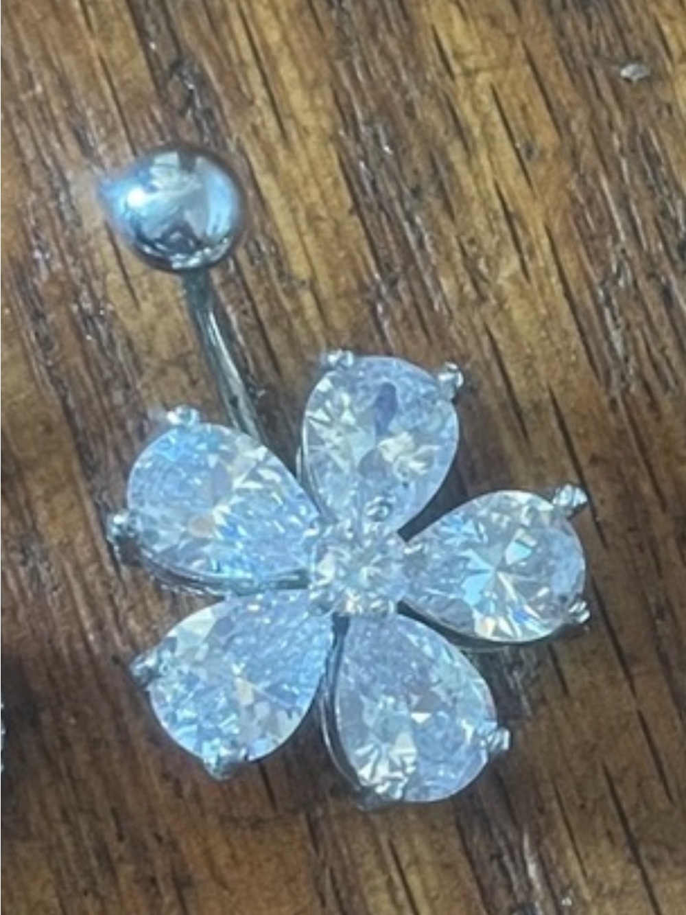Flower belly button piercing